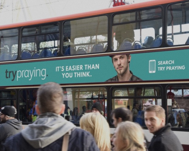 A Try Praying advert on the side of a bus